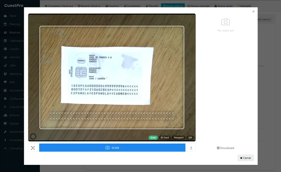 DocuGuest scanner modal opened on top of GuestPro. The GuestPro sidebar is visible behind. The scanner shows a live camera view with an ID card filling the frame and the MRZ visible at the bottom, document type tabs (Auto, ID Card, Passport, QR), a Scan button and an upload icon